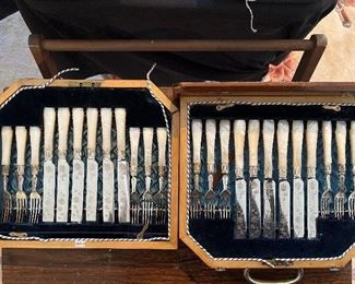 Living Room:  This is a gorgeous Mother-of-Pearl fish set.  It includes 12 forks and 12 knives.  Notice the engraved knife blades and forks.