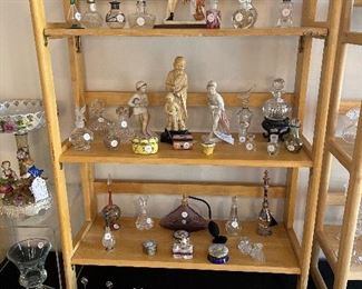 Living Room:  Riser #4 shows more perfume bottles and trinket boxes as well as an "A.  SANTINI" porcelain  figure.  Two B & G figures of a girl with an umbrella flank a 10" tall carved Chinese wise man and child.  On the bottom right is a beautiful Murano glass dish.  A closer photo of the porcelain figures follows.