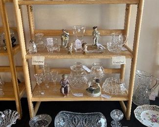 Living Room:  Riser #5 displays  STEUBEN and WATERFORD crystal, cut and pressed glass, DRESDEN, and ROYAL COPENHAGEN figures (a boy reading; a fawn with a Satyr).  Some closer photos follow.