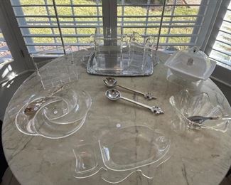 Kitchen:  Several pieces of Lucite and acrylic are displayed.