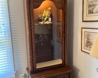 Bedroom#2:  This lighted HARRISON curio with glass shelves also has two lower drawers.  It measures 33" wide x 19" deep x 88" tall.