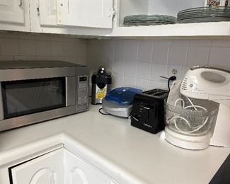 Kitchen:  Small appliances include:  stainless GE microwave; CUISINART juicer; George Foreman Lean Mean Fat Machine; CUISINART toaster; and a GE Hand/Stand mixer.  