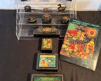 Living Room:  A collection of Russian Lacquer boxes and associated book are each priced.