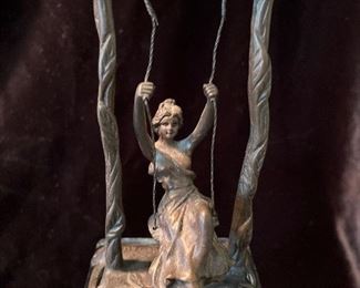 Living Room:  This 5-3/4" bronze figure of a neoclassical woman on a swing is signed "Moreau."