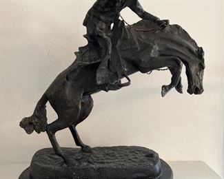 Living Room:  A 12" tall bronze restrike of "Bronco Buster" by Frederic Remington is very heavy!!!!  It is "as found," as the rider is missing his whip.