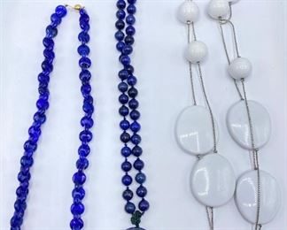 3 Necklaces: Blue Beads With 18 Karat Gold Clasp, Stone Buddha & Double Long White Beads
Lot #: 70