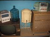 Two vintage Kitchenaire radios (still in their shipping package).
Antique water dispenser.
Vintage TV and Radio.