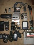 Minolta Maxxum 7000 camera with accessories.
Nikkon digital amd more.