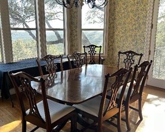 Henredon dining table on casters with 3 leaves and a set of 8 Henredon Chippendale Mahogany chairs, chairs and table are sold separately