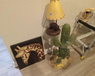 Buffalo lamp, cactus table and metal giraffe picture