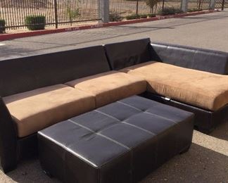 Brown Leather Like Sectional With Matching Ottoman Beige Cushions