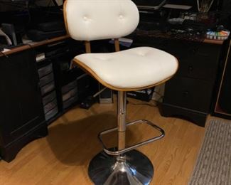 Bar stool, goes up and down. Modern design.