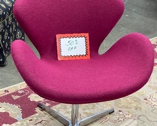 Gorgeous raspberry fabric and super comfortable swivel “Swan” style chair