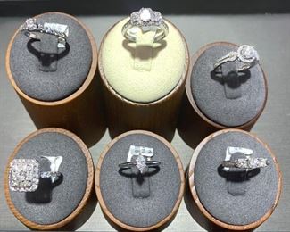All rings are 14K white or yellow gold and diamonds. We have a large selection in store. 