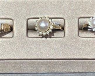 These rings are all set in 14 karat yellow gold worth pearls and diamonds. We have a large selection of rings with gemstones and diamonds in store. 