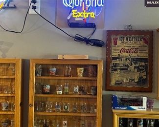 Several pieces of neon, wicked shot glass collection