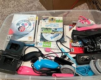 Wii sport stuff including board several games and handheld controllers 