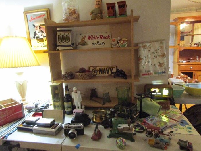 Lot's of cool treasures including a 2 sided White Rock sign, transistor radios, camera, Winston Churchill by Royal Doulton and more