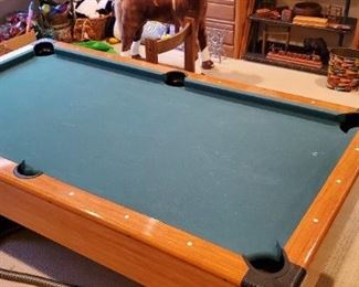pool table with cue, cue rack and accessories