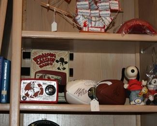 Hopalong Cassidy radio, Snoppy Felix the cat dolls, signed footballs, signed Roger Staubach book.
