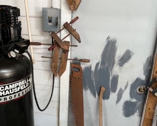 Antique two-man saw and Wood woodworking clamps