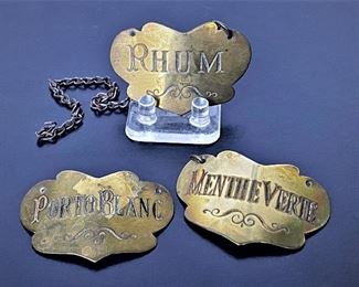 Antique brass liquor tags