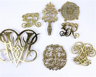 Various vintage solid brass trivets such as This Queen Anne cipher brass trivet was manufactured by Virginia Metal-crafters, and distributed exclusively to Colonial Williamsburg