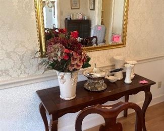 Sofa table with large beveled mirror above