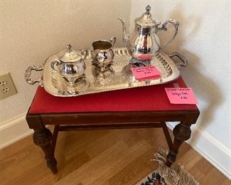 Antique stool, Silver plate tea pot, sugar and creamer and rectangular footed tray