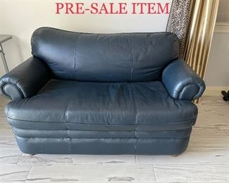 Navy leather loveseat sleeper as is.  $150 + tax