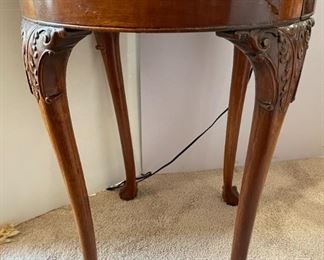 Carved round wood side table
