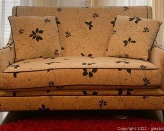 Cream and Black Floral Loveseat with Curved Seat Back