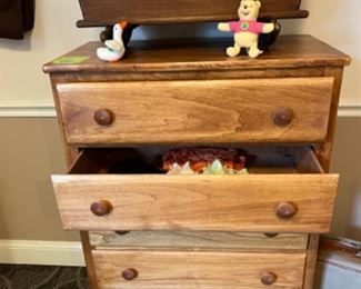 Chest of drawers with linens, doll clothes, baby doll cradle 