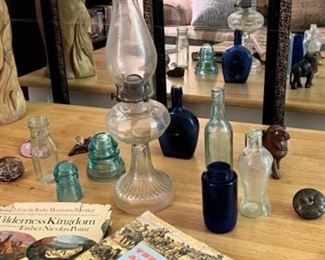 Bottle, books, lanterns