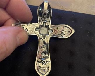 back of cross and signature -we have no idea who this designer is -  but its a very well made and well designed piece- if you know this  brand call me and enlighten me !!