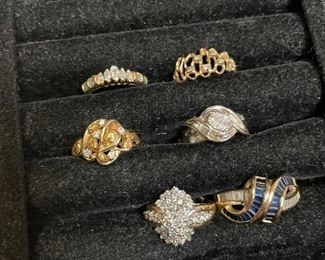 gold rings - more info will come  just wanted to get some pics up !    top right ring14k w/ tiny diamond accents $89,    top left 14k diamond band $375, middle left 14k w/ diamonds $229,  bottom left diamond cluster ring 5-5.5  (has a sizer in it ) $239