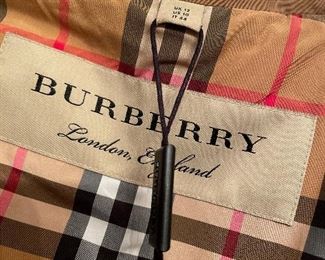 new w/ tags burberry size 10 rain/trench coat- fits a med well almost to a large but not quite- see more pics- $499