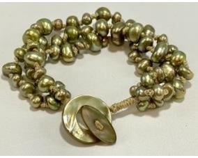 Lot # 39 
Honora Triple Strand Freshwater Pearl Bracelet With Mother Of Pearl Toggle Clasp. Green