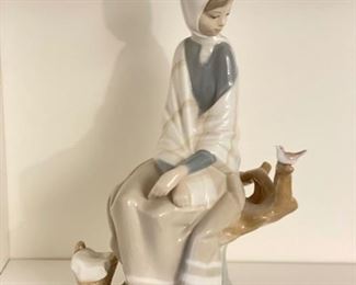 Lladro Peasant Girl Sitting on Stump with Basket & Dove. Measures 10" x 6"W . Photo 1 of 3.
