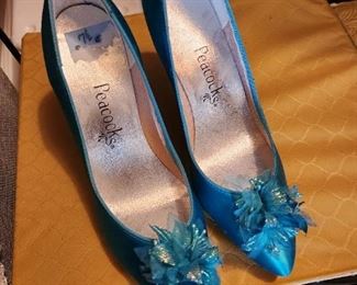 Lots of glamour shoes as well as everyday shoes...in various sizes. This aqua blue color is one of our client's favorite colors. 