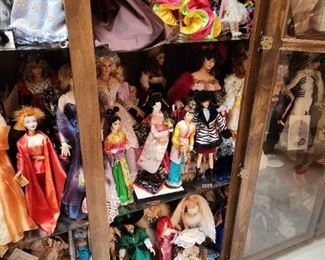 A giant Gallery Case from floor to ceiling filled with specialty dolls! 