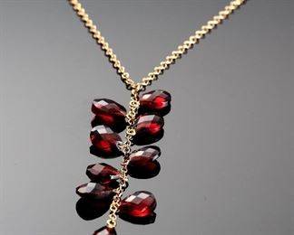 14K Gold Garnet 9 Gemstone Necklace 	16.5in Long<BR>Gemstone: 7x5mm	

