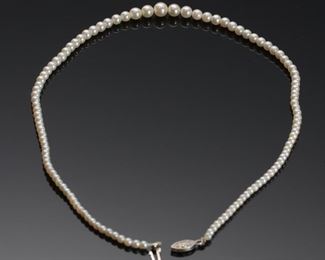 Graduated Pearl Necklace 14k white Gold Clasp 	17in Long<BR>Largest Pearl: 6.5mm diameter 	
