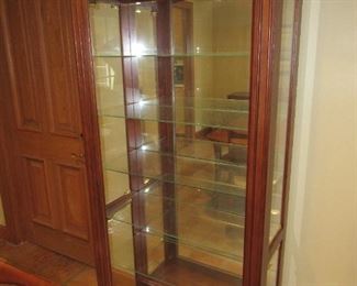 Lighted mirrored curio cabinet