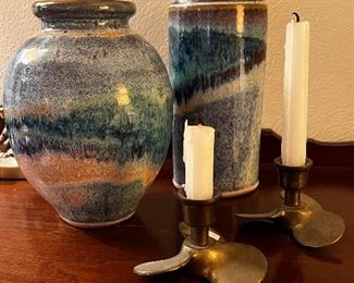 Art pottery and a pair of brass propeller candle holders