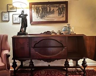 Handsome sideboard with ornate legs, two drawers and side cabinets.
