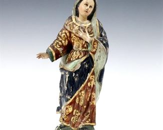 A 19th century Spanish Colonial carved wood Santos figure.  Depicts The Madonna with inset glass eyes, polychrome decoration and Gilded detail.  Some wear and damage, significant flaking, some touch-ups.  12 1/4" high.  ESTIMATE $300-400
