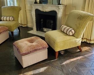 Upholstered armless chairs and pair of designer ottomans