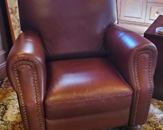 One of a pair of leather studded club chairs ITALIAN