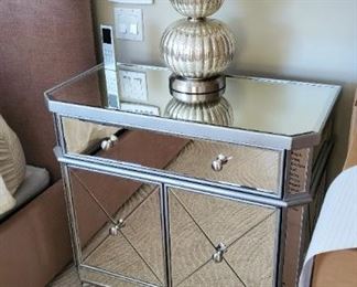 One of a pair of mirrored cabinets